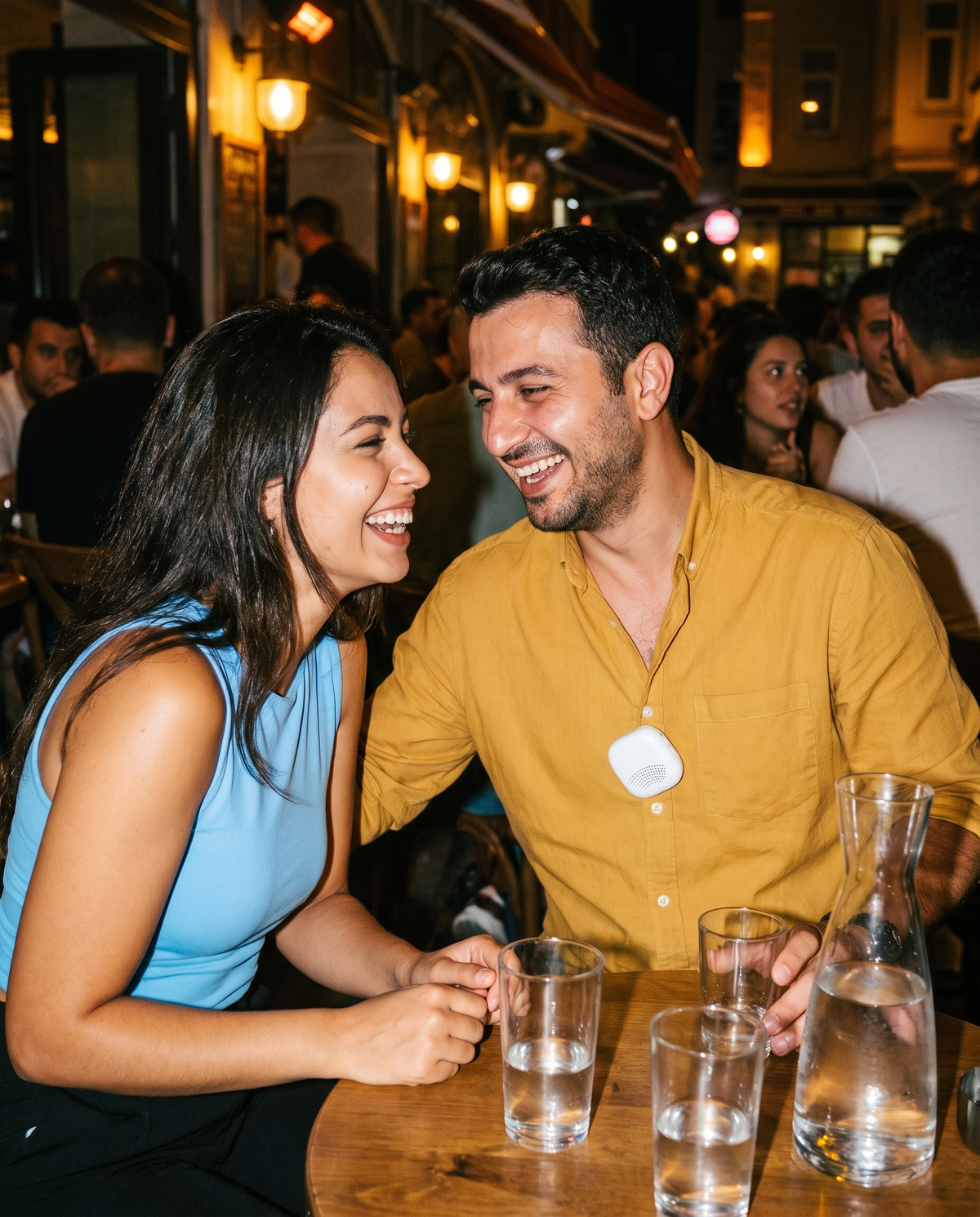Turkish man and Brazilian woman laughing in an Istanbul bar